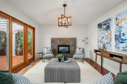 120 Lake Placid Road Se, Calgary, AB - Indoor Photo Showing Living Room With Fireplace