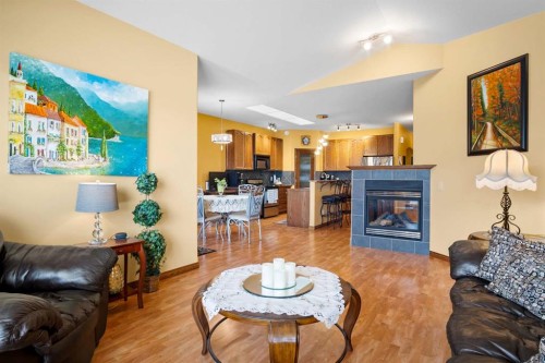 41 Stromsay Gate, Carstairs, AB - Indoor Photo Showing Living Room With Fireplace