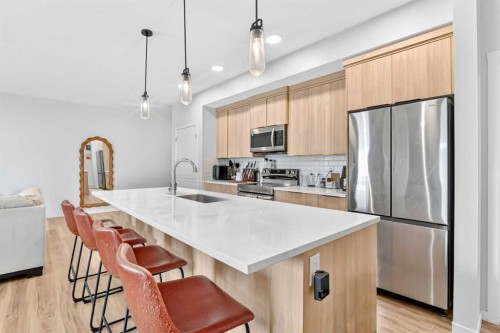 3208-220 Seton Grove Se, Calgary, AB - Indoor Photo Showing Kitchen With Upgraded Kitchen
