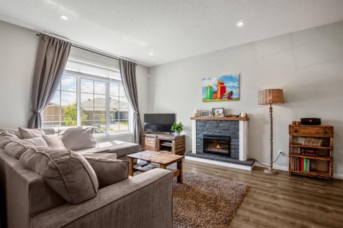30 Wolf Crescent, Okotoks, AB - Indoor Photo Showing Living Room With Fireplace