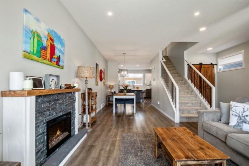 30 Wolf Crescent, Okotoks, AB - Indoor Photo Showing Living Room With Fireplace