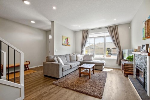 30 Wolf Crescent, Okotoks, AB - Indoor Photo Showing Living Room With Fireplace