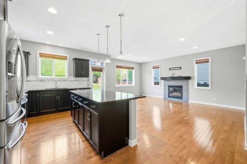 80 Sherwood Crescent Nw, Calgary, AB - Indoor Photo Showing Kitchen With Fireplace With Upgraded Kitchen