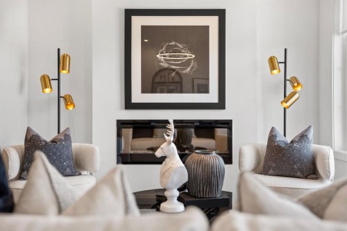 512-8155 8 Avenue Sw, Calgary, AB - Indoor Photo Showing Living Room With Fireplace