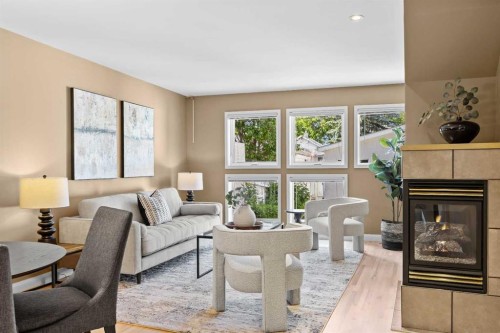 415 28 Avenue Nw, Calgary, AB - Indoor Photo Showing Living Room With Fireplace