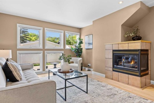 415 28 Avenue Nw, Calgary, AB - Indoor Photo Showing Living Room With Fireplace