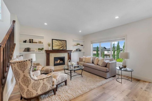 83 Ravenscroft Close Se, Airdrie, AB - Indoor Photo Showing Living Room With Fireplace