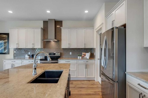 83 Ravenscroft Close Se, Airdrie, AB - Indoor Photo Showing Kitchen With Double Sink