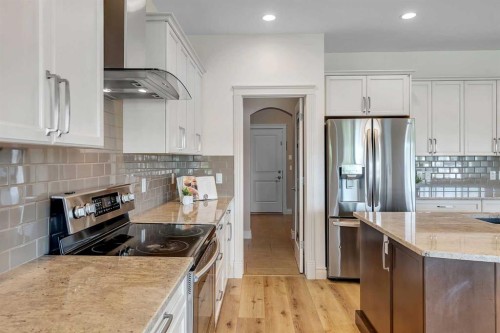 83 Ravenscroft Close Se, Airdrie, AB - Indoor Photo Showing Kitchen With Double Sink With Upgraded Kitchen