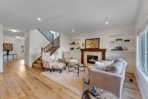 83 Ravenscroft Close Se, Airdrie, AB - Indoor Photo Showing Living Room With Fireplace