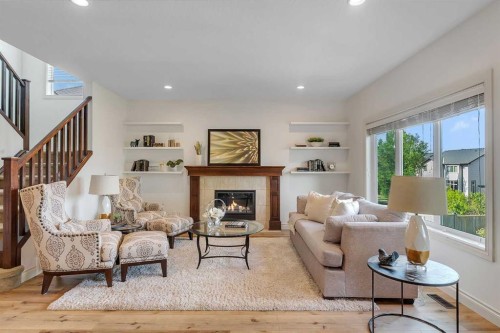 83 Ravenscroft Close Se, Airdrie, AB - Indoor Photo Showing Living Room With Fireplace
