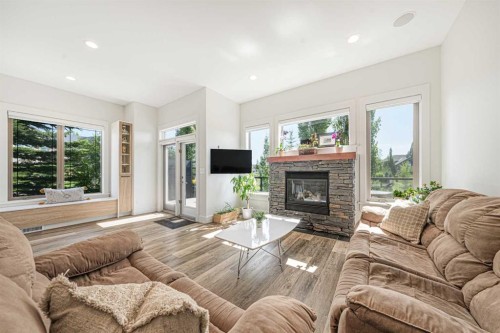 2 Discovery Ridge Heights Sw, Calgary, AB - Indoor Photo Showing Living Room With Fireplace