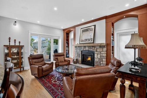1640 16 Street Se, Calgary, AB - Indoor Photo Showing Living Room With Fireplace