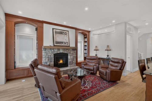 1640 16 Street Se, Calgary, AB - Indoor Photo Showing Living Room With Fireplace
