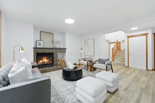 2020 Bridlemeadows Manor Sw, Calgary, AB - Indoor Photo Showing Living Room With Fireplace
