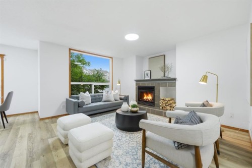 2020 Bridlemeadows Manor Sw, Calgary, AB - Indoor Photo Showing Living Room With Fireplace