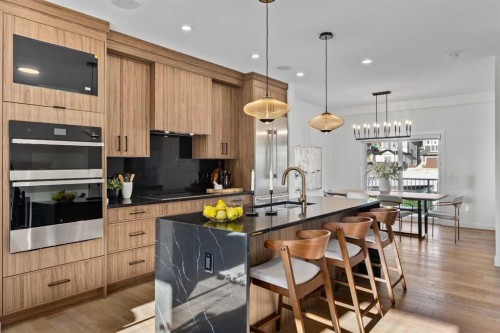 13 Topaz Place, Cochrane, AB - Indoor Photo Showing Kitchen With Upgraded Kitchen