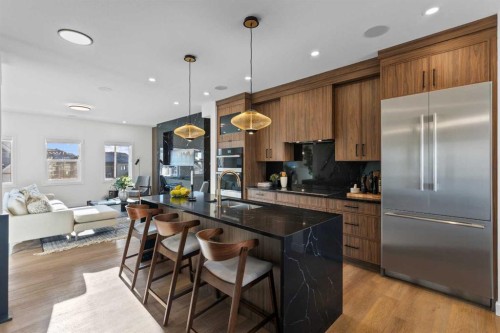 13 Topaz Place, Cochrane, AB - Indoor Photo Showing Kitchen With Stainless Steel Kitchen With Upgraded Kitchen