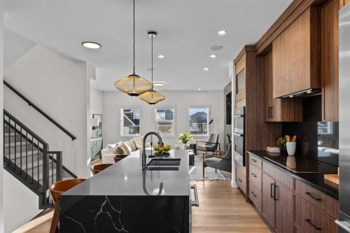 13 Topaz Place, Cochrane, AB - Indoor Photo Showing Kitchen With Upgraded Kitchen