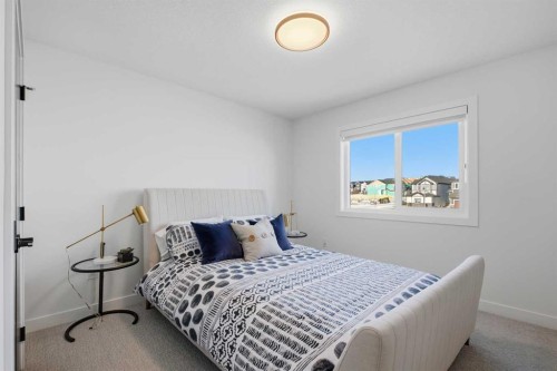 13 Topaz Place, Cochrane, AB - Indoor Photo Showing Bedroom