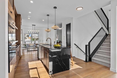 13 Topaz Place, Cochrane, AB - Indoor Photo Showing Kitchen With Upgraded Kitchen