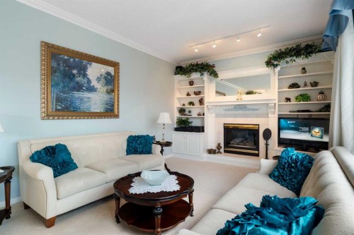 1649 Evergreen Hill Sw, Calgary, AB - Indoor Photo Showing Living Room With Fireplace
