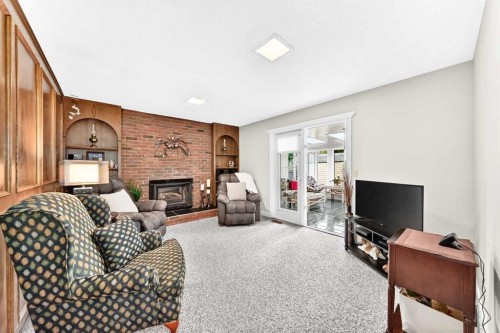39 Deer Run Place Se, Calgary, AB - Indoor With Fireplace