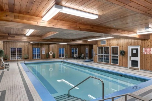 244-8535 Bonaventure Drive Se, Calgary, AB - Indoor Photo Showing Other Room With In Ground Pool