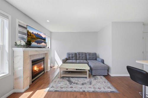 33 Saddlecrest Close Ne, Calgary, AB - Indoor Photo Showing Living Room With Fireplace