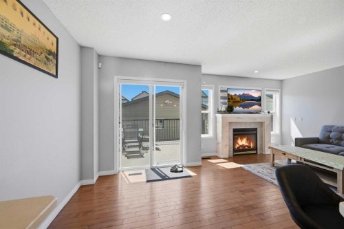 33 Saddlecrest Close Ne, Calgary, AB - Indoor Photo Showing Living Room With Fireplace