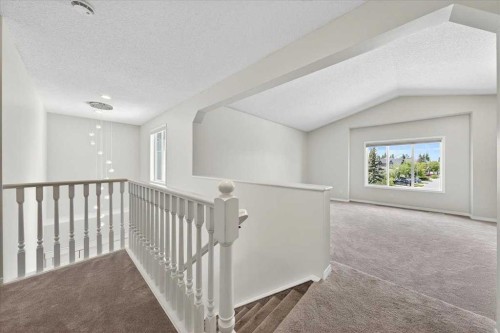 18 Cougarstone Bay Sw, Calgary, AB - Indoor Photo Showing Other Room