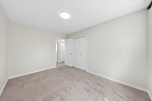 18 Cougarstone Bay Sw, Calgary, AB - Indoor Photo Showing Other Room