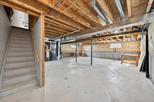 18 Cougarstone Bay Sw, Calgary, AB - Indoor Photo Showing Basement