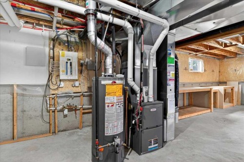 18 Cougarstone Bay Sw, Calgary, AB - Indoor Photo Showing Basement