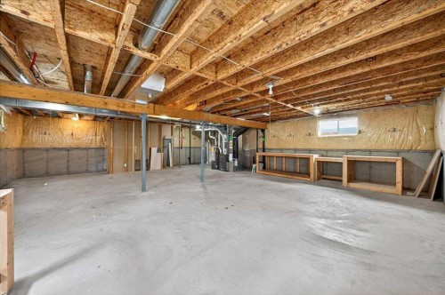 18 Cougarstone Bay Sw, Calgary, AB - Indoor Photo Showing Basement