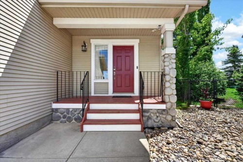 18 Cougarstone Bay Sw, Calgary, AB - Outdoor With Deck Patio Veranda With Exterior