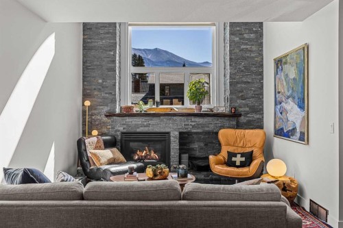 3-601 4, Canmore, AB - Indoor Photo Showing Living Room With Fireplace