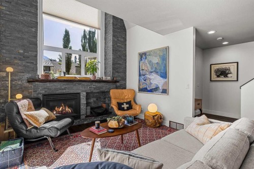 3-601 4, Canmore, AB - Indoor Photo Showing Living Room With Fireplace