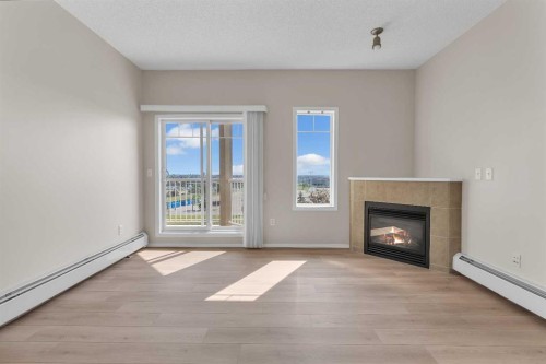 6307-70 Panamount Drive Nw, Calgary, AB - Indoor Photo Showing Living Room With Fireplace