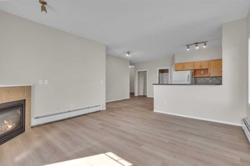 6307-70 Panamount Drive Nw, Calgary, AB - Indoor Photo Showing Living Room With Fireplace