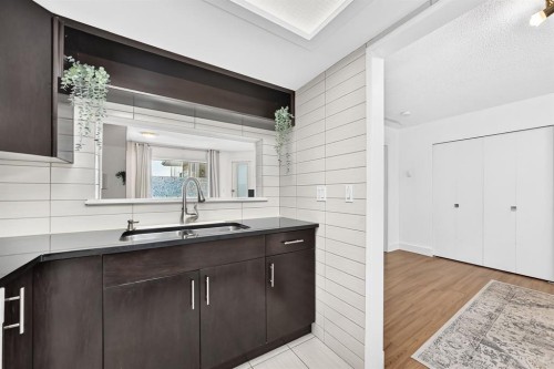 307-3717 42 Street Nw, Calgary, AB - Indoor Photo Showing Kitchen With Double Sink