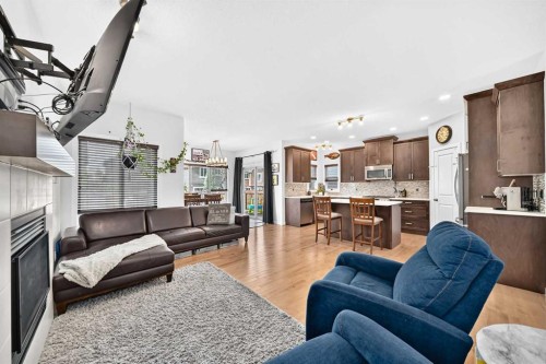 16 Sunrise Crescent, Cochrane, AB - Indoor Photo Showing Living Room