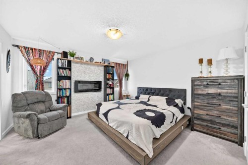 16 Sunrise Crescent, Cochrane, AB - Indoor Photo Showing Bedroom