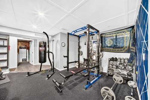 16 Sunrise Crescent, Cochrane, AB - Indoor Photo Showing Gym Room