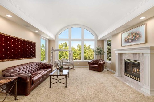 33 Ridge Pointe Drive, Heritage Pointe, AB - Indoor Photo Showing Living Room With Fireplace