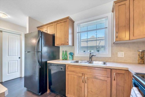 2520 Eversyde Avenue Sw, Calgary, AB - Indoor Photo Showing Kitchen With Double Sink