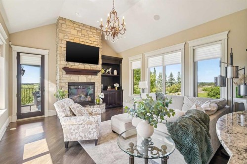 39 Red Willow Crescent West, Rural Foothills County, AB - Indoor Photo Showing Living Room With Fireplace