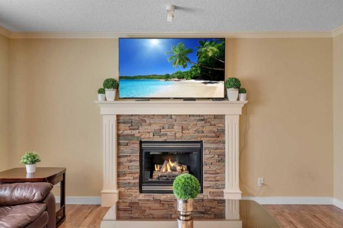 105 West Creek Pond, Chestermere, AB - Indoor Photo Showing Living Room With Fireplace