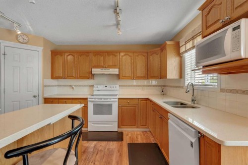 105 West Creek Pond, Chestermere, AB - Indoor Photo Showing Kitchen With Double Sink