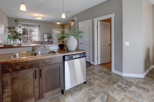 249 Ranch Ridge Meadow, Strathmore, AB - Indoor Photo Showing Kitchen With Double Sink